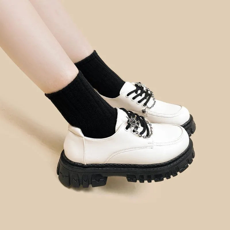 Women's Duke Asterism colour loafers with a metal cross shoulder strap and round toe.