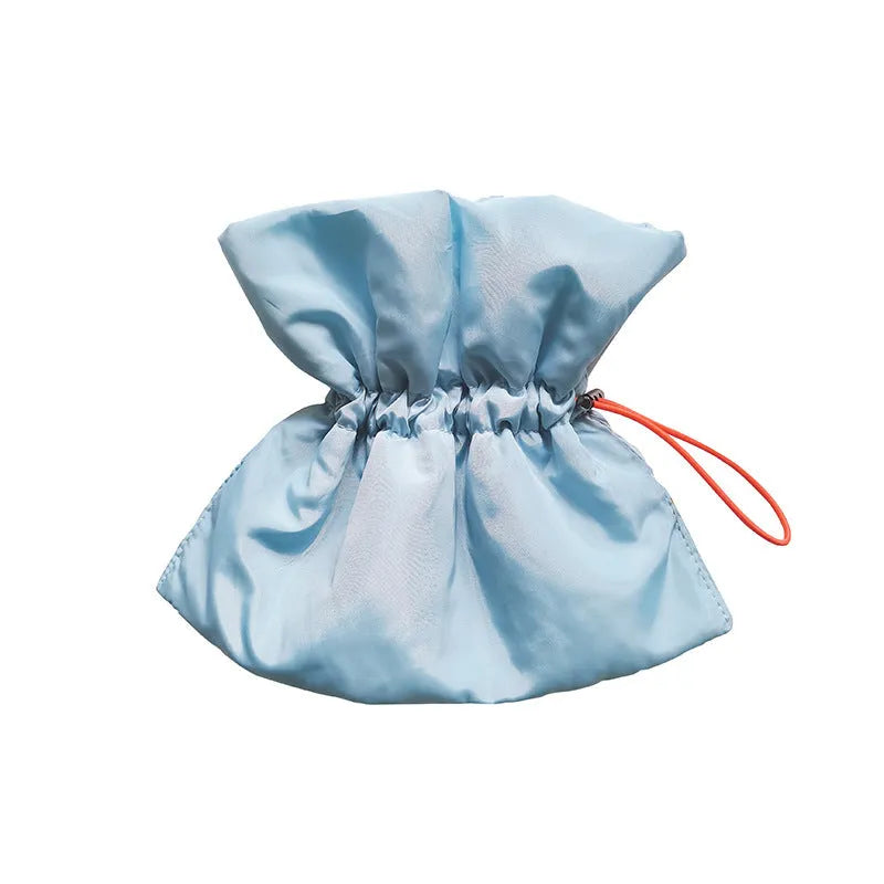 Adjustable soft cat recovery collar in light blue colour showing elastic buckle and polyester construction