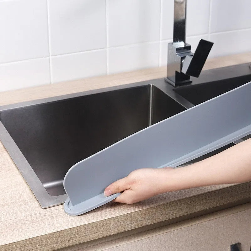 Silicone kitchen sink water blocking plate in black, blue, and grey colours showing 52x5x85mm dimensions