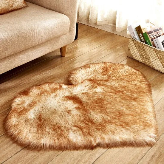 Heart-shaped plush carpet in multiple colours showing wool-like texture with 5-6 cm pile length