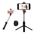 Compact black aluminium Bluetooth selfie stick with integrated tripod legs and a 360-degree rotating phone clip.