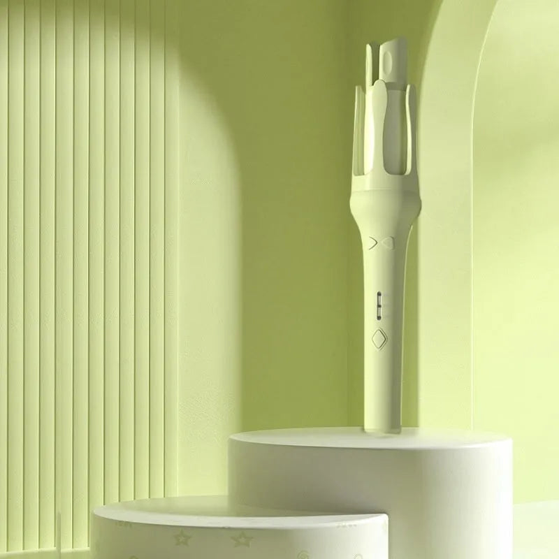 White and pink automatic hair curler with 32mm ceramic barrel and auto-clamp feature on a table.