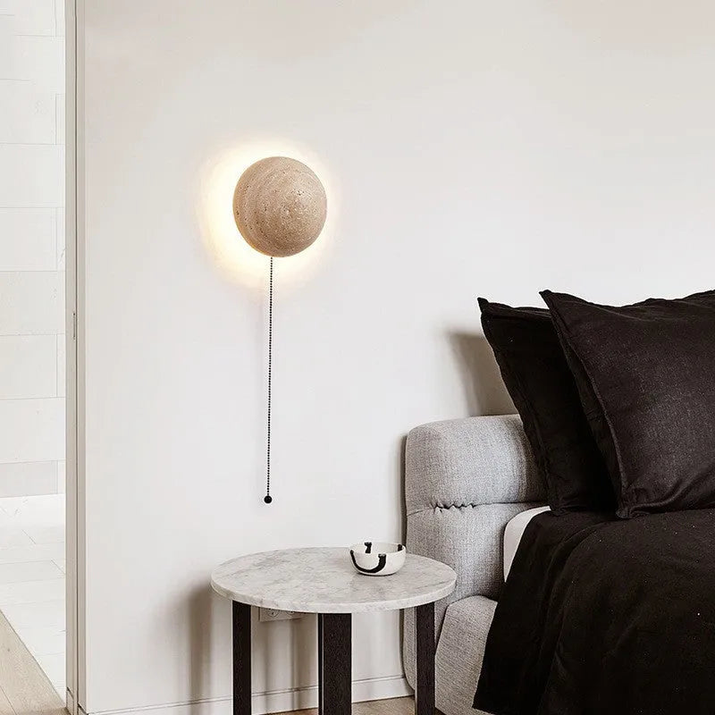 Yellow semicircle cave stone wall lamp with wooden base, shown as a bedside or stair light.