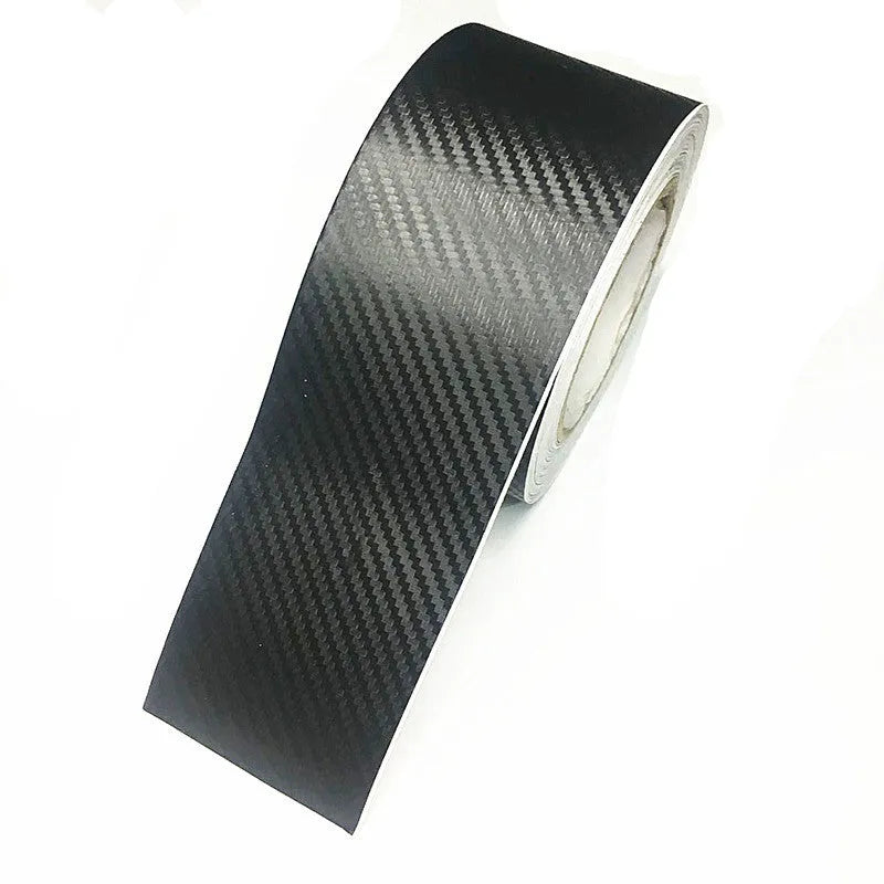 Matte carbon fibre pattern vinyl roll for car door sill protection, showing textured surface and roll format.