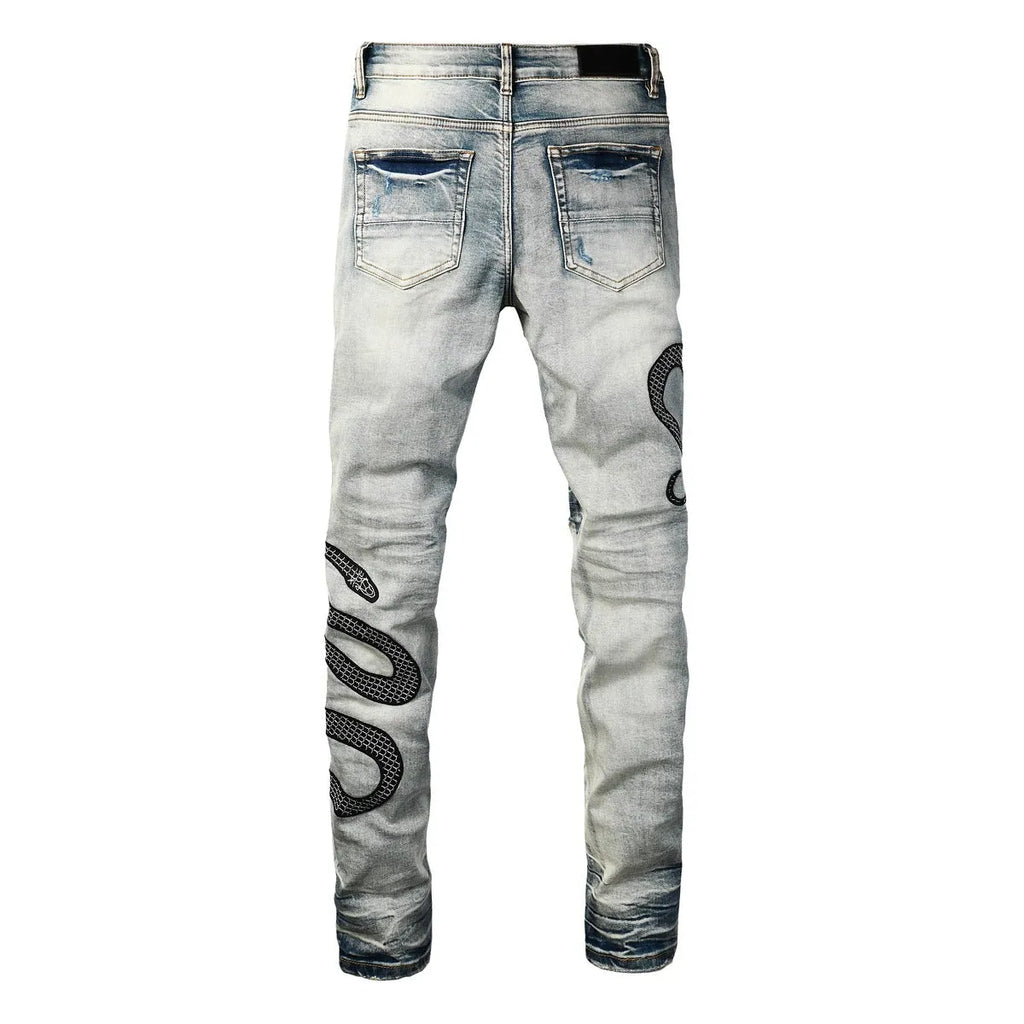 Blue distressed street fashion skinny jeans with a button fly and tight leg fit.