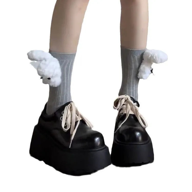 Matte black women's lace-up shoes with a chunky muffin heel and thick rubber sole