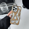 Silver electroplated iPhone case with hollow flame pattern design on a dark background