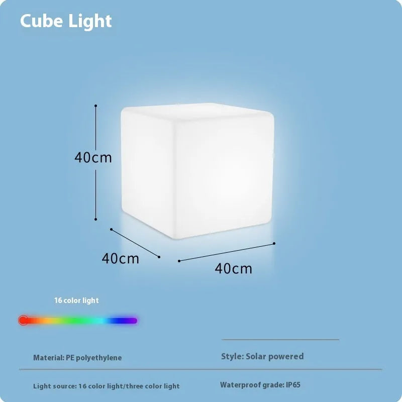 Modern square LED cube light stool in a garden setting, showcasing its clean design and luminous top.