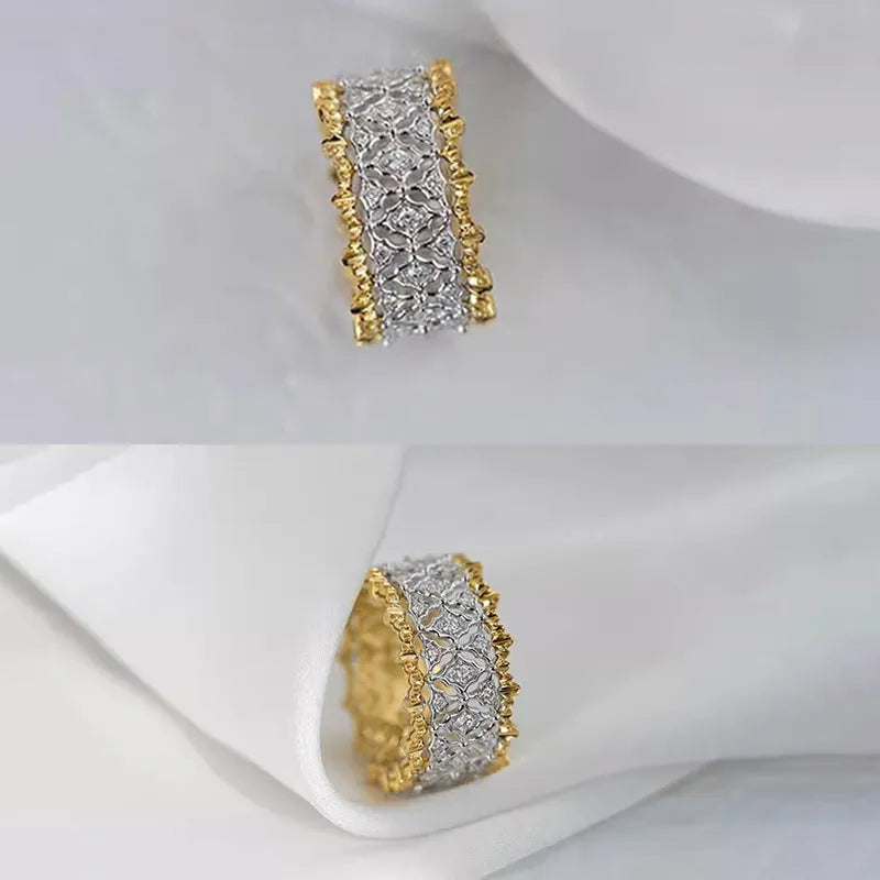 A geometric two-tone gold zircon ring on a hand, showing its round design and copper construction.