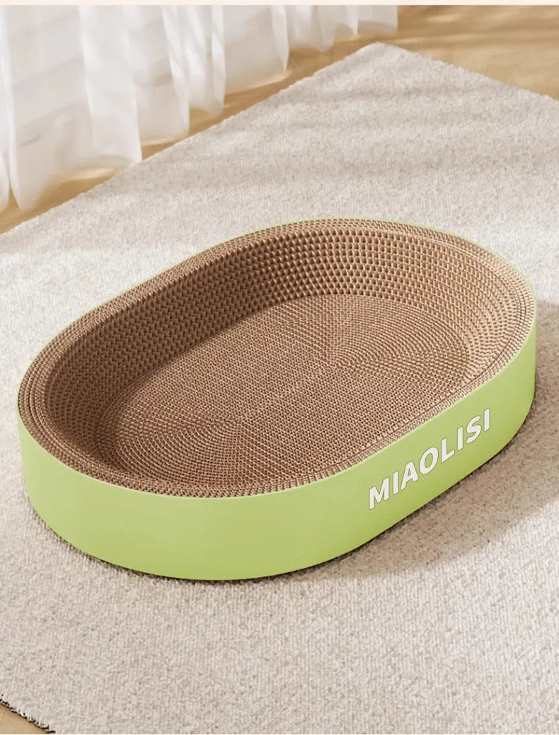Green oval corrugated paper cat scratch board and nest with a 55cm diameter.