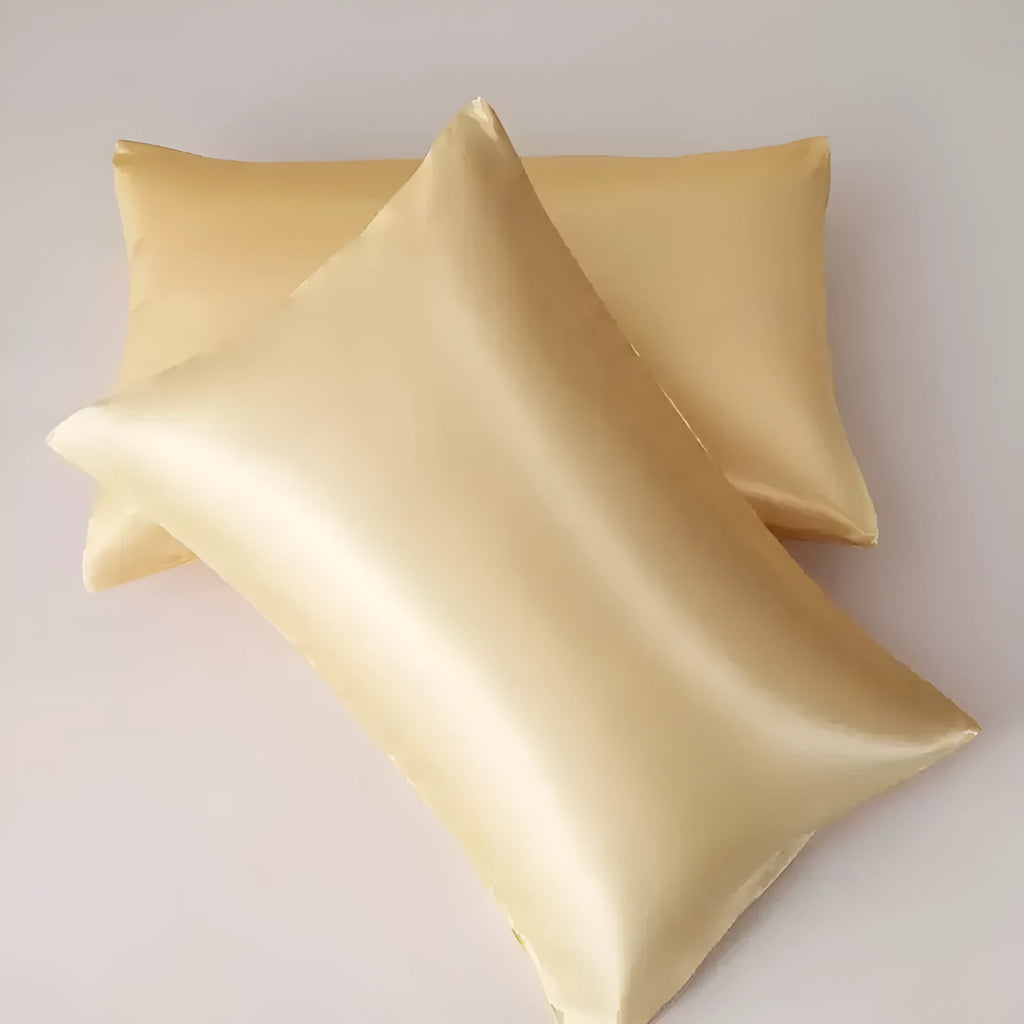 A pair of solid colour satin cloth pillowcases in a choice of thirteen colours including navy blue and rose red.