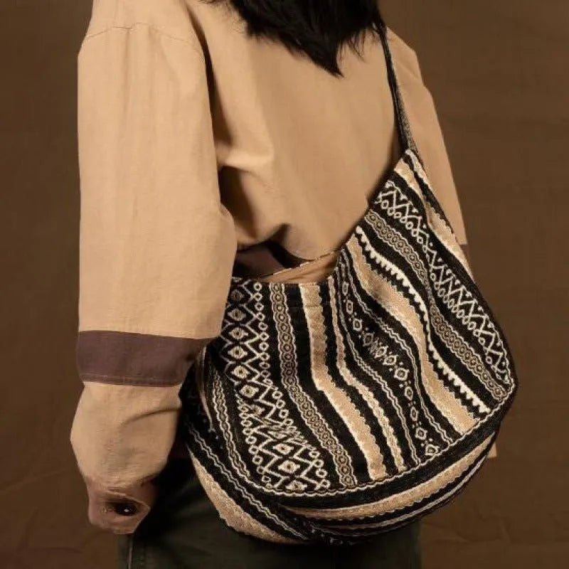 Retro striped corduroy messenger bag with adjustable shoulder strap showing jacquard pattern