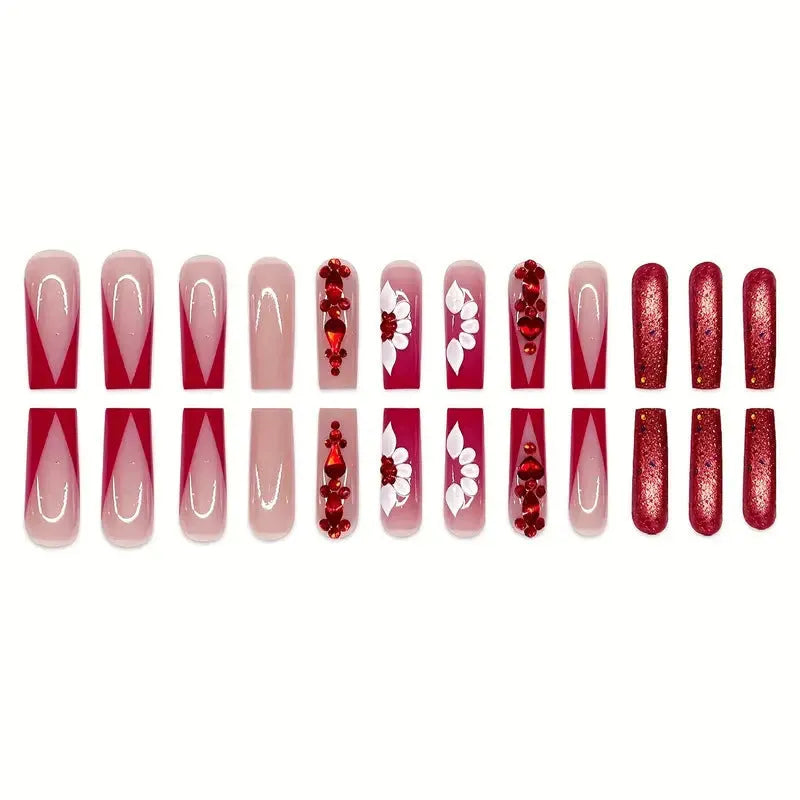 Long European square fake nails with sweet floral pattern and prismatic red diamond crystal accents.