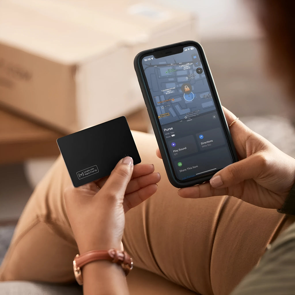 Black ultra-thin anti-loss alarm card for Apple devices next to a credit card for size comparison.