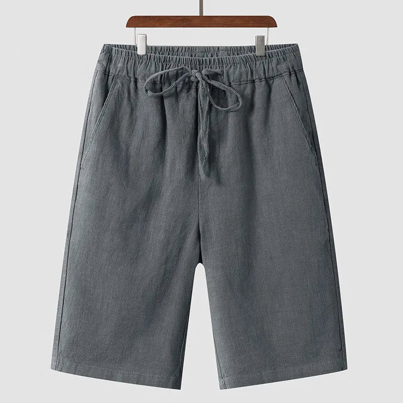 Men's linen shorts in loose cropped style with elastic waistband in various colours