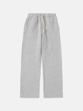 Men's grey fleece-lined sweatpants with elastic drawstring waist and loose fit trousers