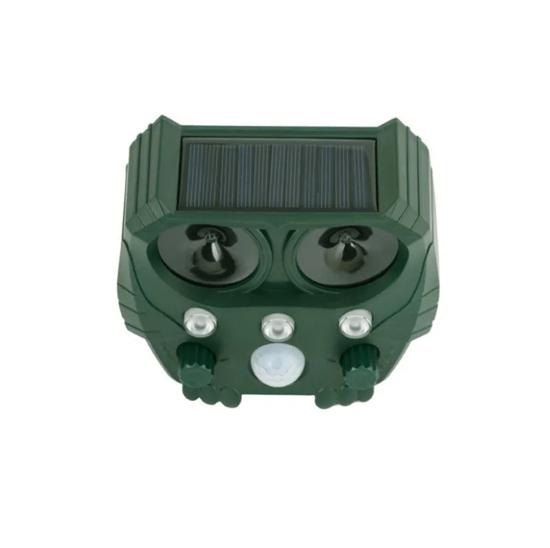 Green solar-powered ultrasonic animal repeller unit for outdoor pest and dog control.