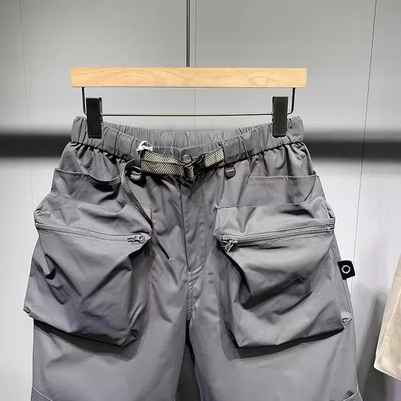 Men's large size work shorts with multiple pockets in black and grey colours