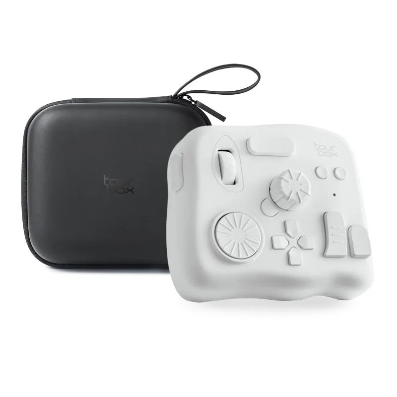 TourBox NEO black video editing controller with dials and buttons on a desk.