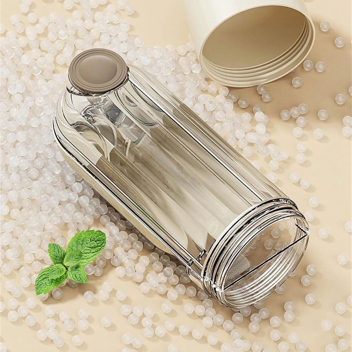 Beige foldable dog water bottle with food dispenser base shown extended and compressed