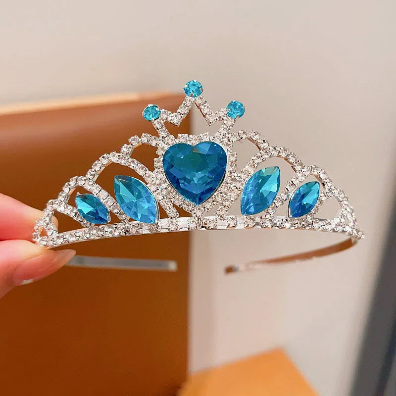 Girl's shiny metal headband with a crystal crown design in pink, light blue, and light purple colours.