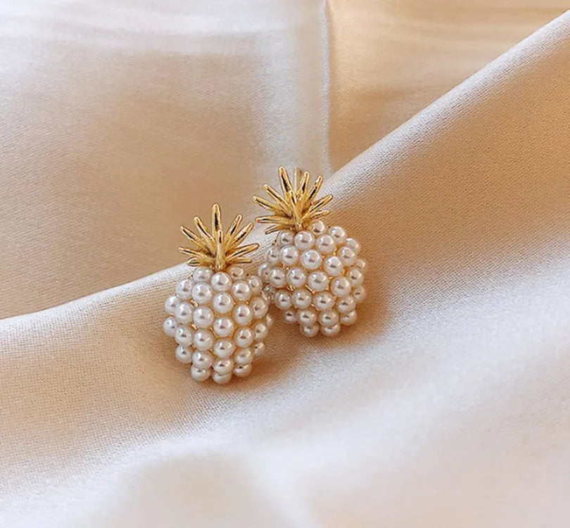 Gold pineapple and starfish pearl Korean style drop earrings with alloy electroplating and inlaid gems.