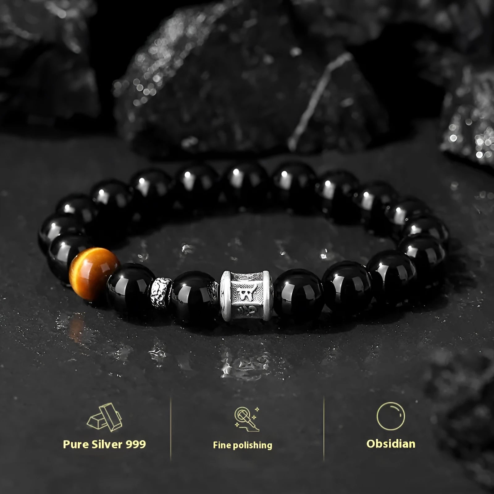 Black obsidian prayer wheel bracelet for men with a hand-woven silver clasp on a wrist.