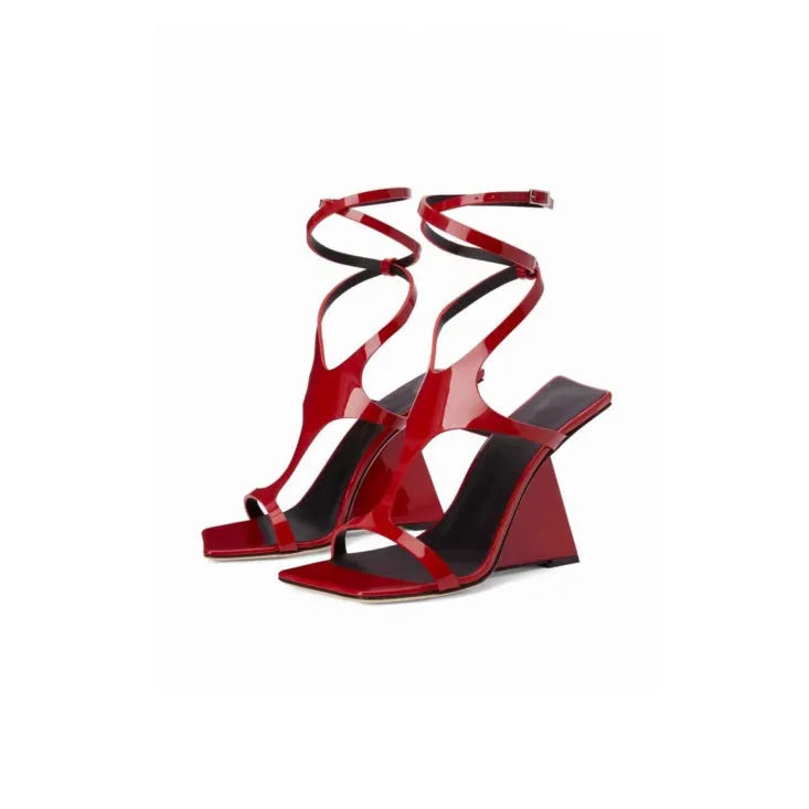 Women's black high heel sandals with a square toe and button ankle strap on a white background.