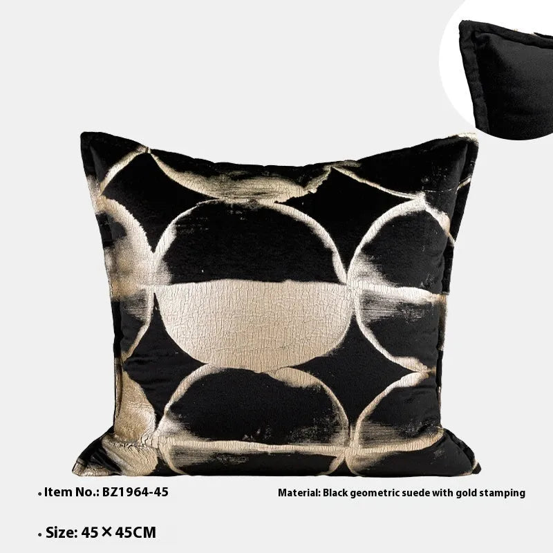 Black and gold abstract pattern flannel cushion cover on a sofa