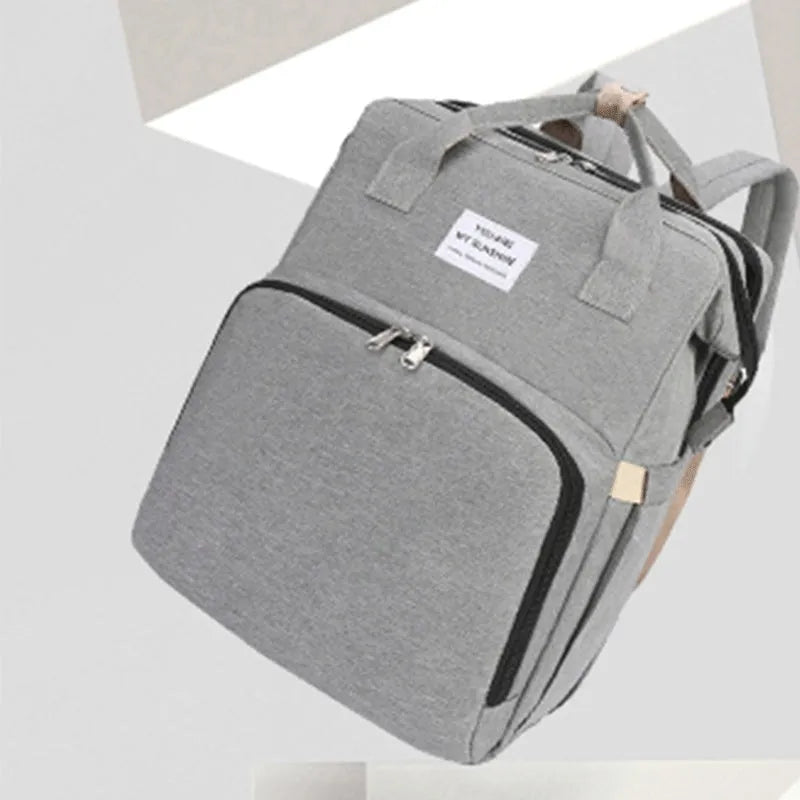 Lightweight nylon mother and baby bag with USB port, curved shoulder strap, shown in blue colour.