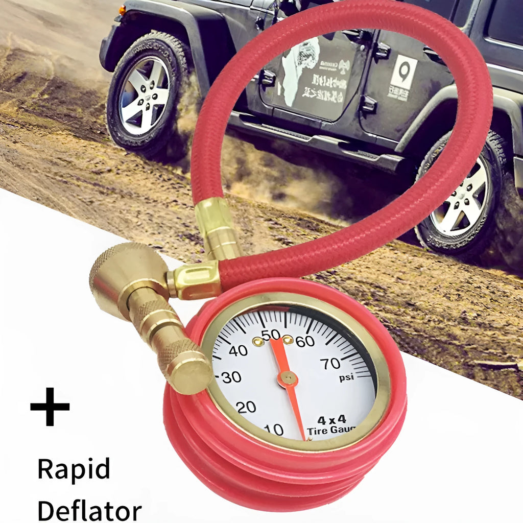 Red and black mechanical automotive tyre pressure gauge with a rapid deflation valve on a rubber shell.