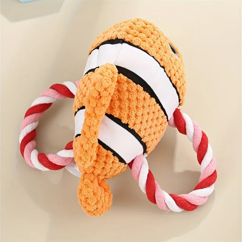 Turtle-shaped plush dog toy with knotted interior and squeaker in grey, green and orange colours