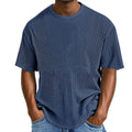 Man wearing a light blue waffle knit short sleeve cotton blend pullover, casual fit