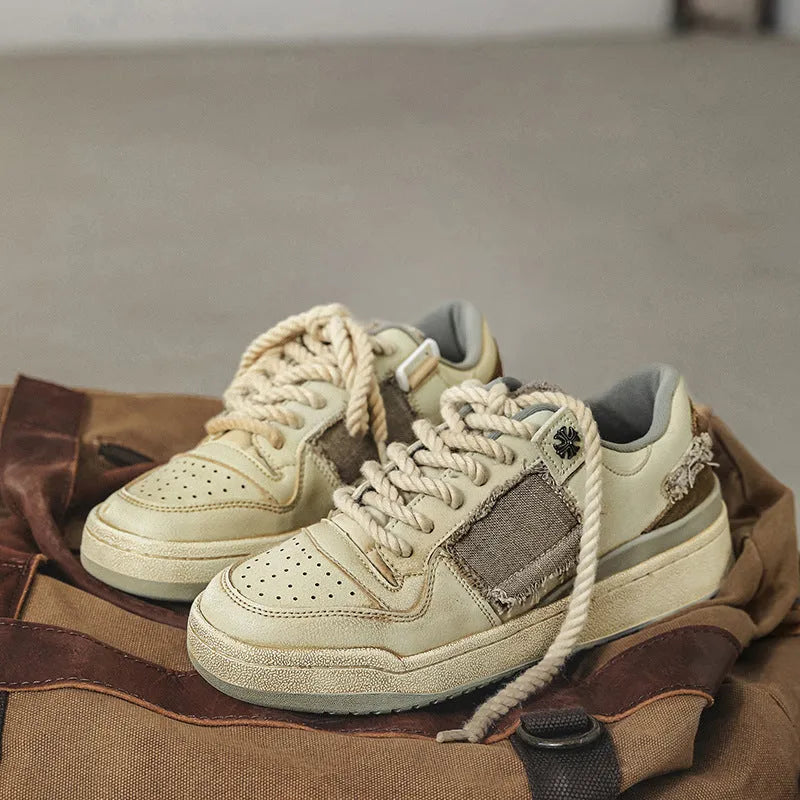 Beige low-top skateboard shoes with microfiber upper and round-toe design