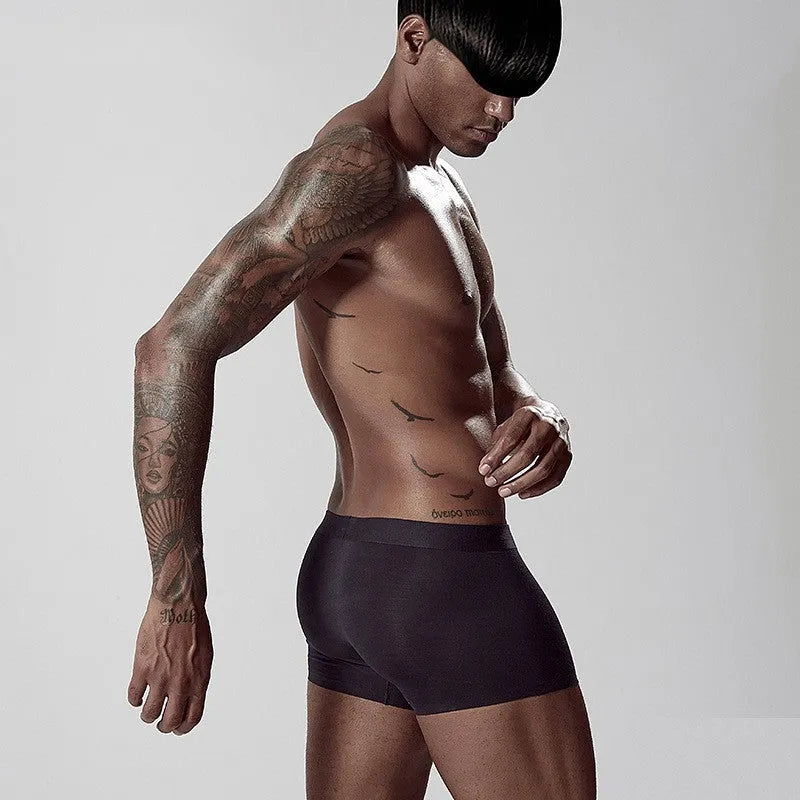 Men's seamless modal underwear in mid-waist fit, shown in green colour.