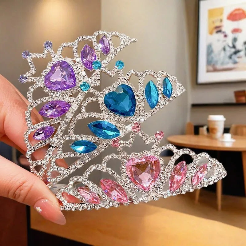 Girl's shiny metal headband with a crystal crown design in pink, light blue, and light purple colours.