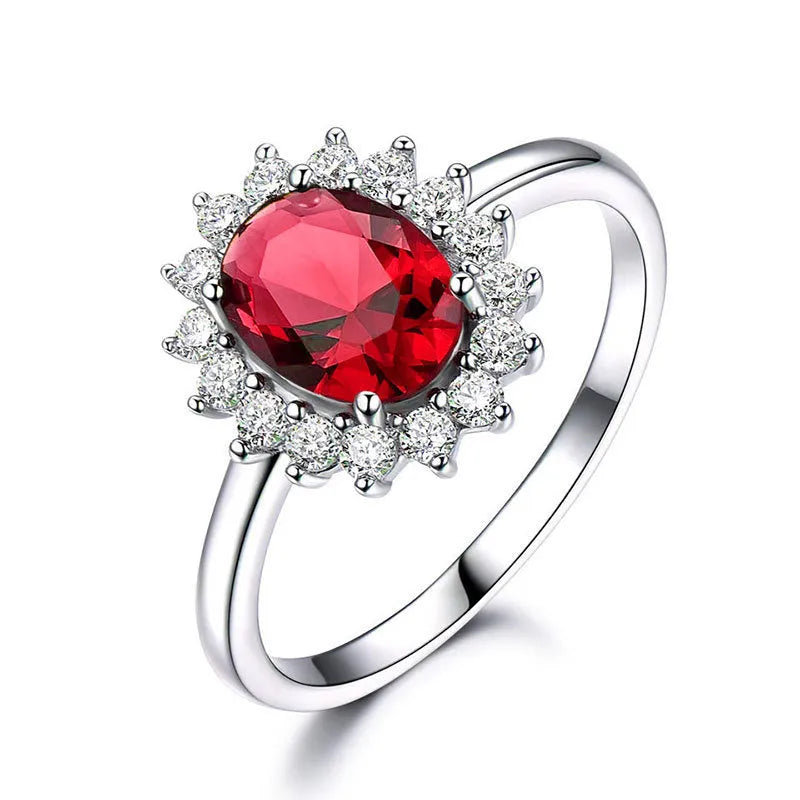Copper floral women's ring with inlaid zirconia stone in green, blue, or red colour on a white background.