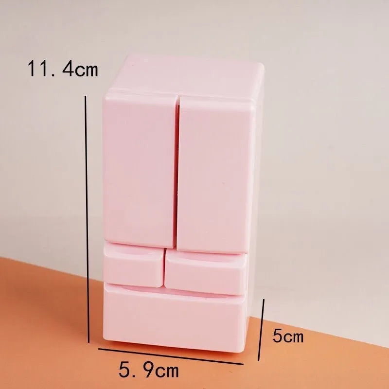 Small white illuminated candy toy model for dollhouse display, shown with light on.