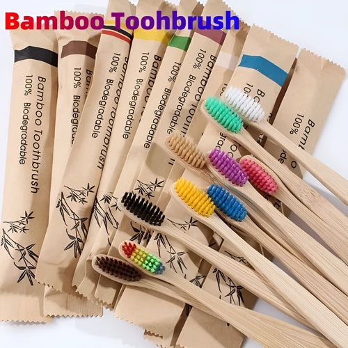 Set of ten bamboo toothbrushes with charcoal bristles in assorted colours on a plain background
