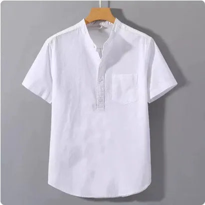 Man wearing a beige slub linen casual shirt with a stand collar and short sleeves.