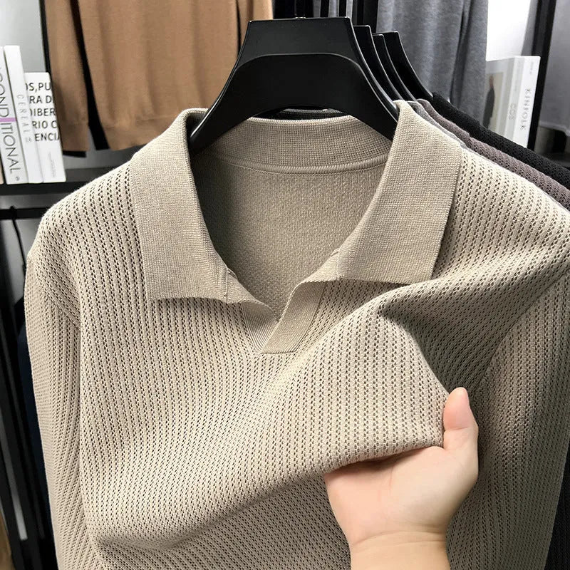 Man wearing a loose fit camel coloured casual pullover sweater.