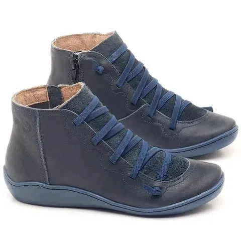 Women's flat casual booties with wedge heel in various colours including leopard print.