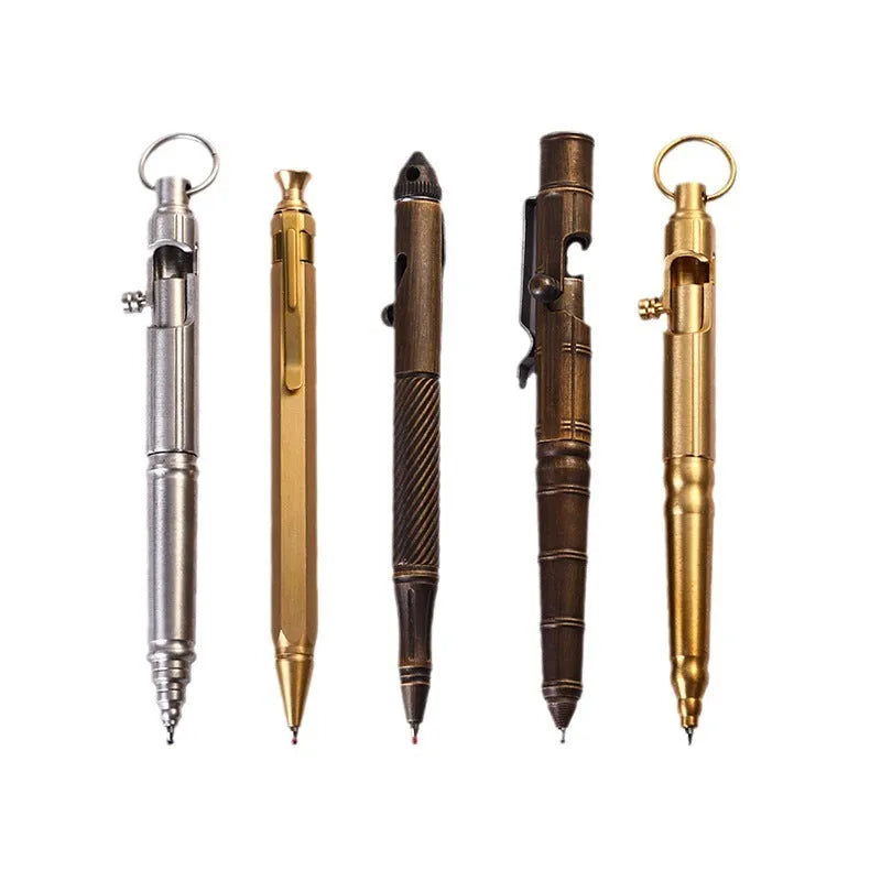 Retro brass tactical pen showing press bolt mechanism and cylindrical barrel in natural brass finish.
