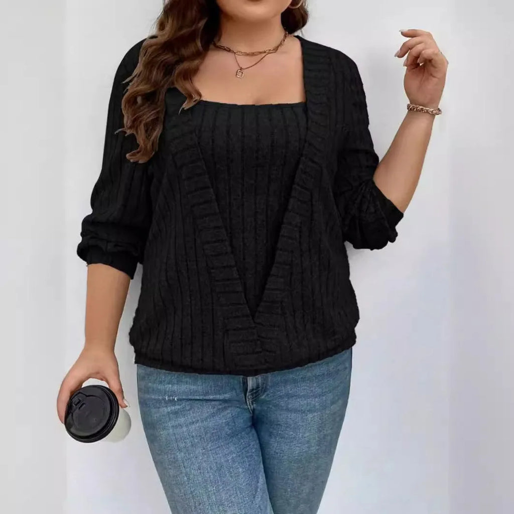 Women's solid colour rib-knit V-neck tunic with a false two-piece skirt design, shown in a loose fit.