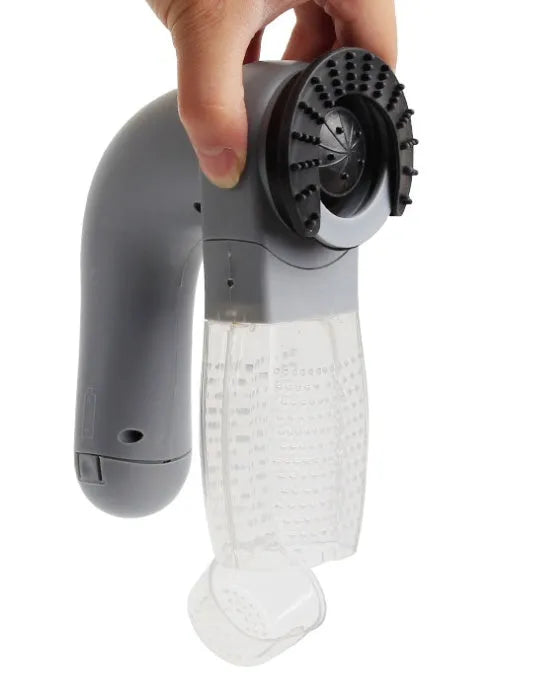 Grey portable electric pet hair removal vacuum with soft rubber grooming head.
