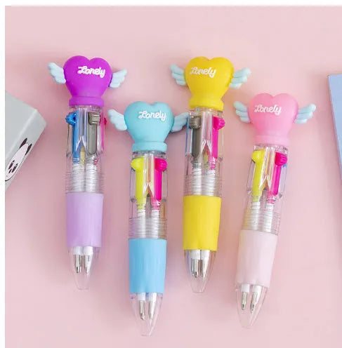 A press-action ballpoint pen with a four-colour cartridge, showing one of five random cartoon designs on the barrel.
