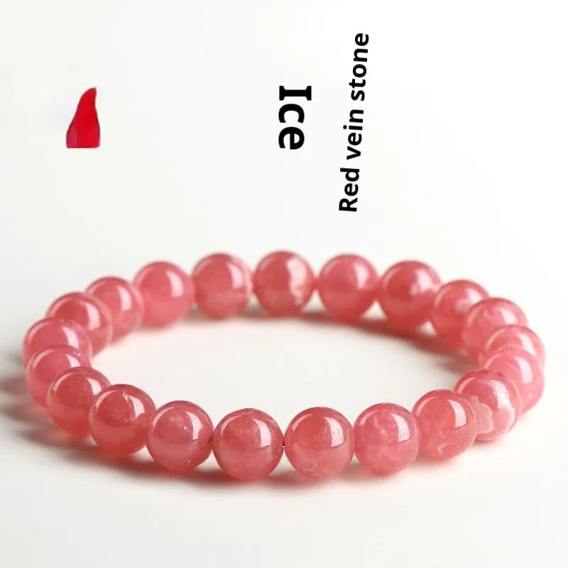 Women's geometric crystal bracelet with a longevity lock, shown in rhodochrosite colours.