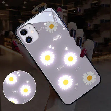 White TPU iPhone case with painted purple daisies and letters, showing voice-activated colour light feature.