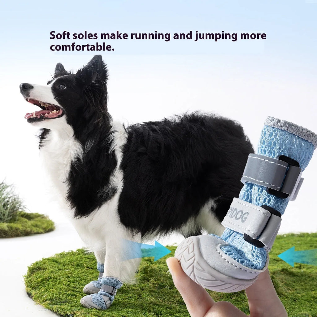 Pair of blue cartoon-style dog shoes with breathable PU uppers and anti-scald soles on a wooden surface.