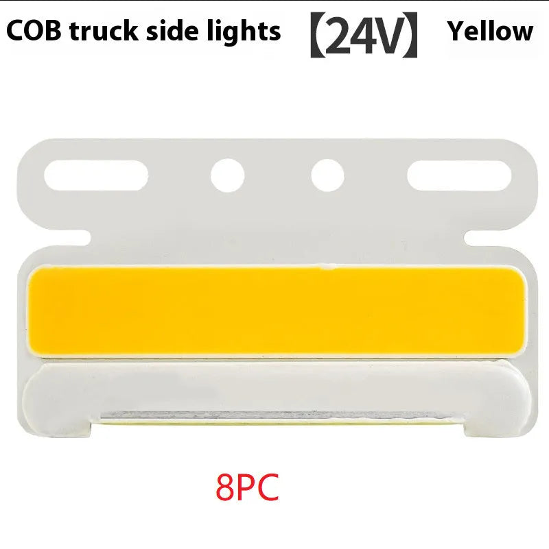 Aluminium alloy COB LED truck side light projecting bright white light onto ground next to tyre.
